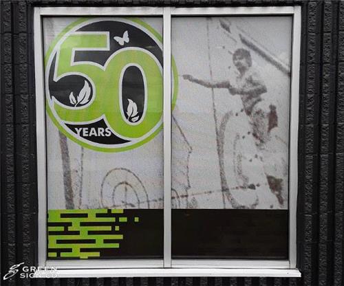 Green Sign Company - Custom Perforated Vinyl Window Graphics